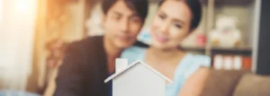 First home buyer couple reviewing government grant documents for their new home purchase in Victoria 2026